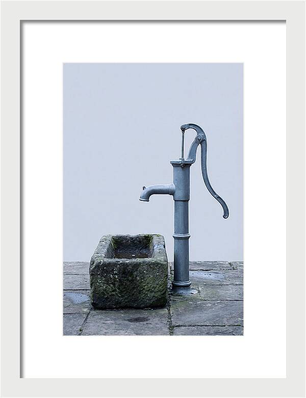 Old Iron Pump Beside Stone Trough