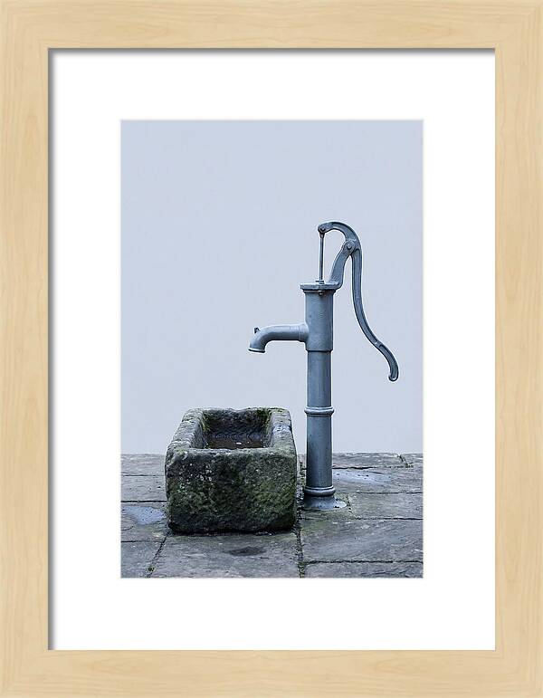 Old Iron Pump Beside Stone Trough
