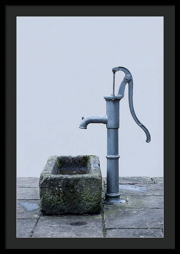 Old Iron Pump Beside Stone Trough