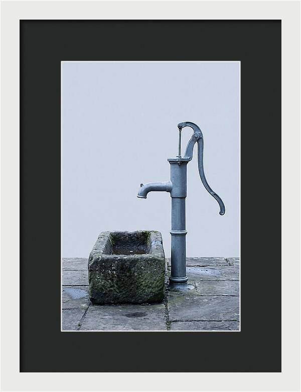 Old Iron Pump Beside Stone Trough