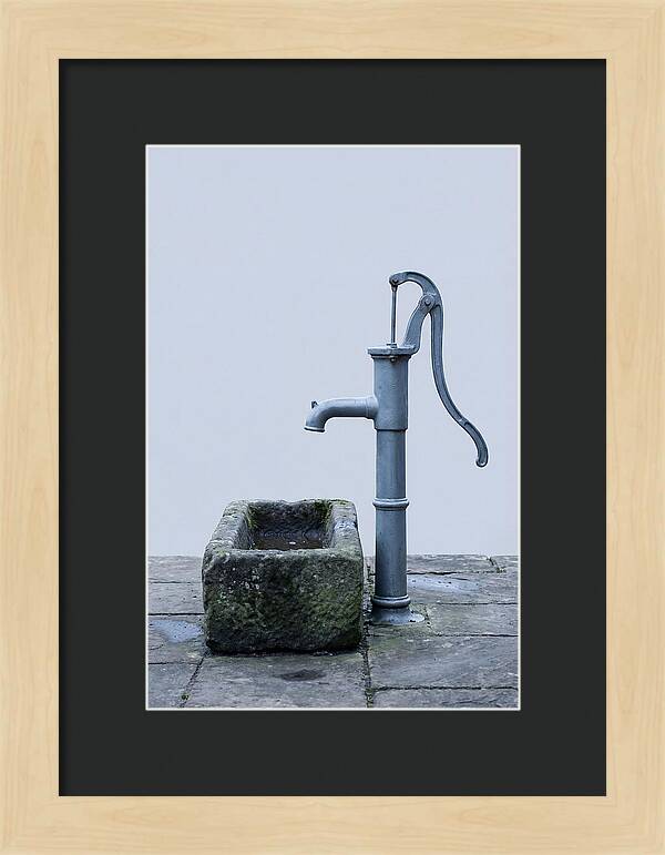 Old Iron Pump Beside Stone Trough