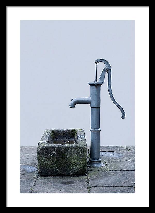 Old Iron Pump Beside Stone Trough