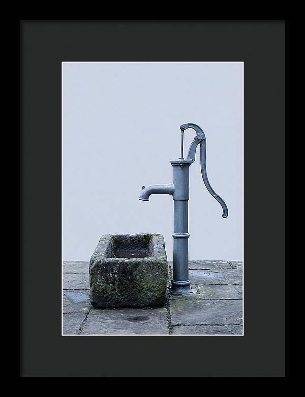Old Iron Pump Beside Stone Trough
