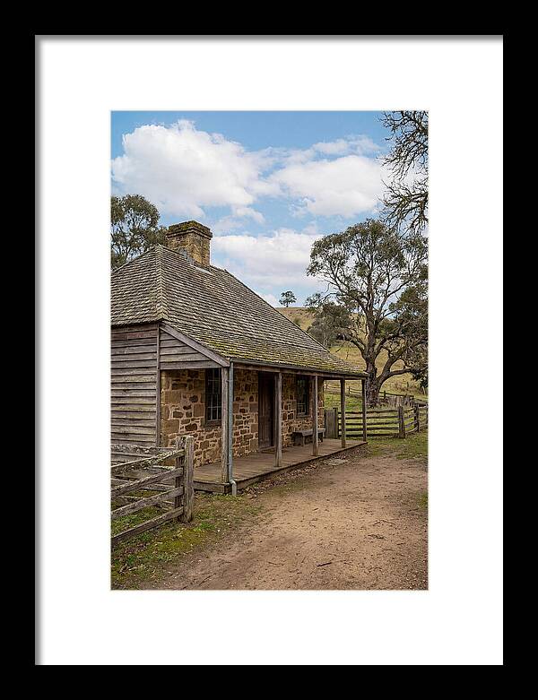 Old Stone Homestead Under Blue Skies