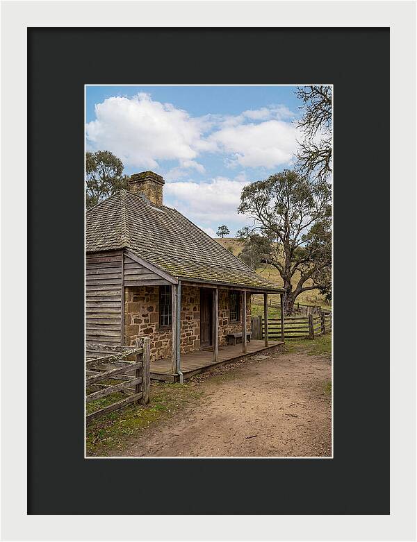 Old Stone Homestead Under Blue Skies