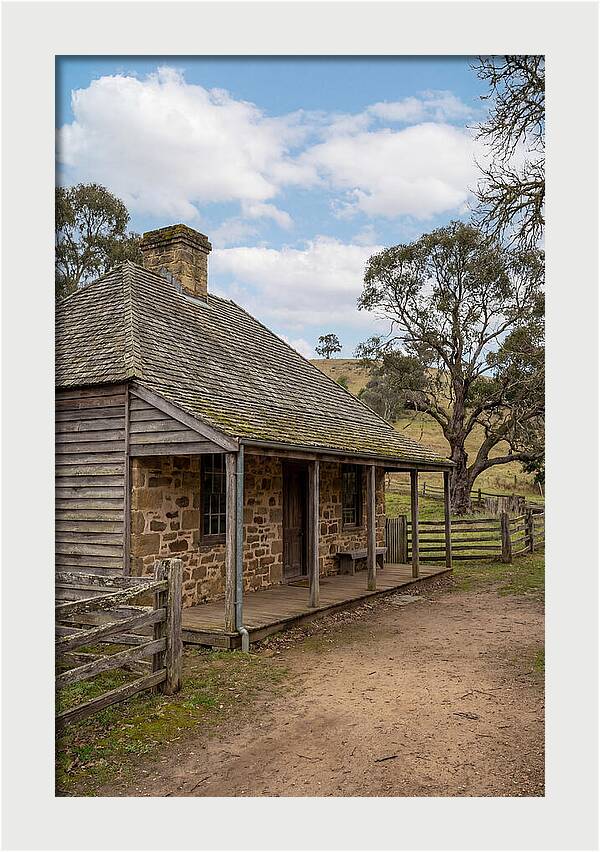 Old Stone Homestead Under Blue Skies