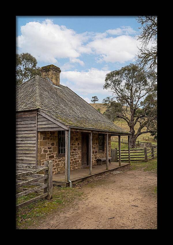 Old Stone Homestead Under Blue Skies