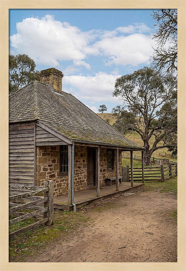 Old Stone Homestead Under Blue Skies