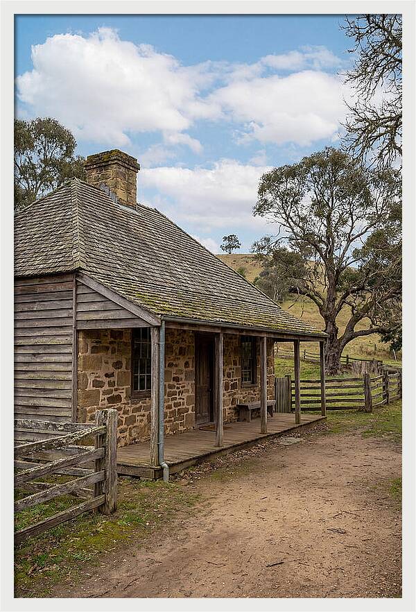 Old Stone Homestead Under Blue Skies
