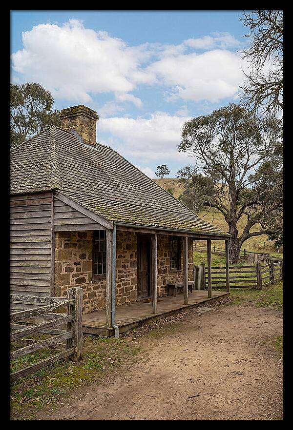 Old Stone Homestead Under Blue Skies