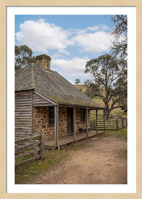 Old Stone Homestead Under Blue Skies