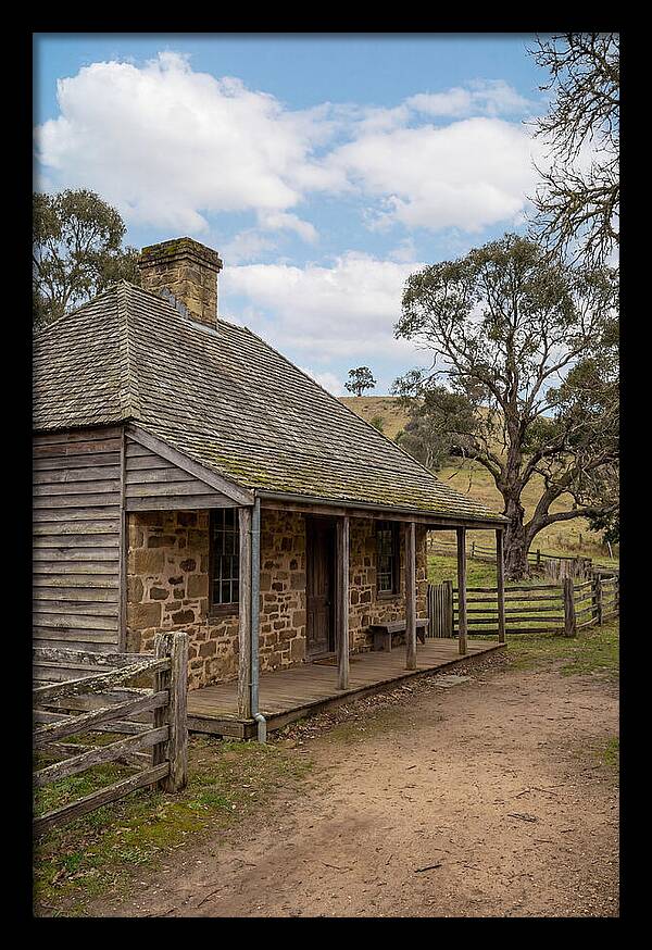 Old Stone Homestead Under Blue Skies