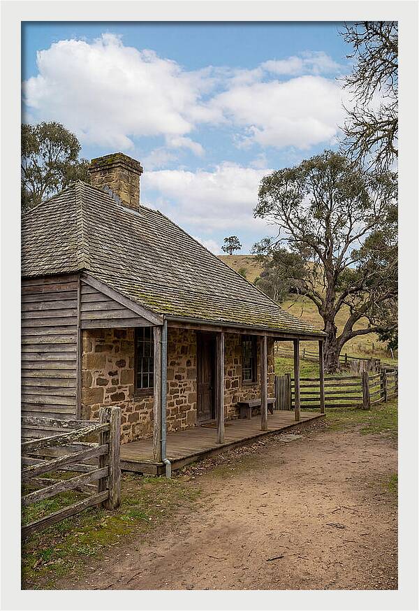 Old Stone Homestead Under Blue Skies