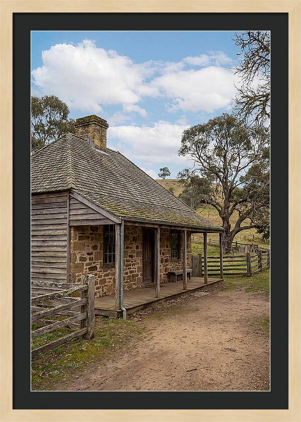 Old Stone Homestead Under Blue Skies