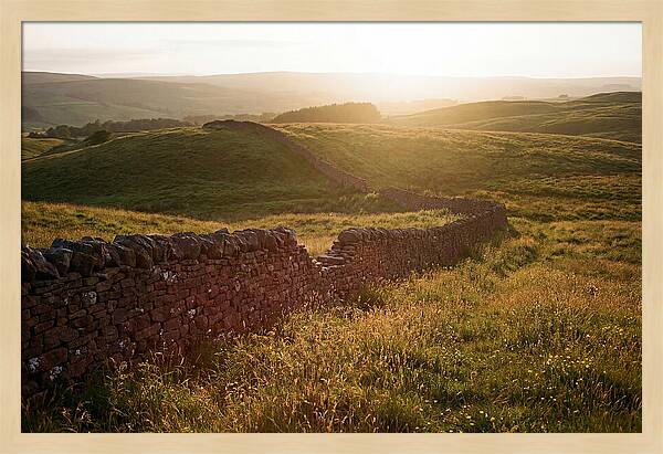 Old Stone Wall Through Green Hills