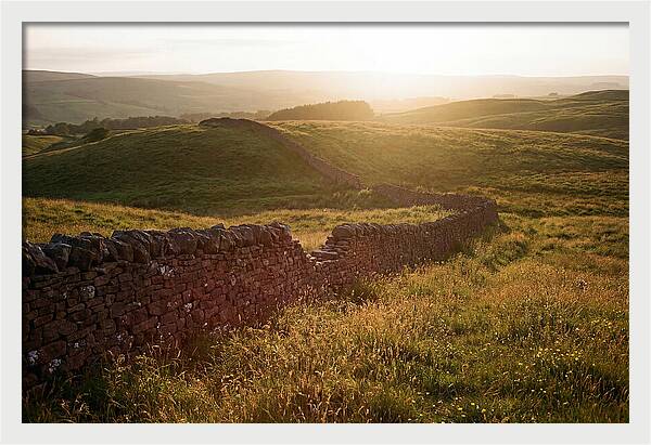 Old Stone Wall Through Green Hills