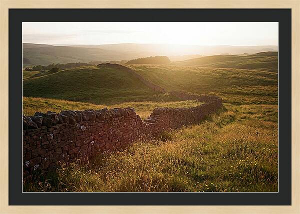 Old Stone Wall Through Green Hills