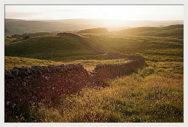 Old Stone Wall Through Green Hills