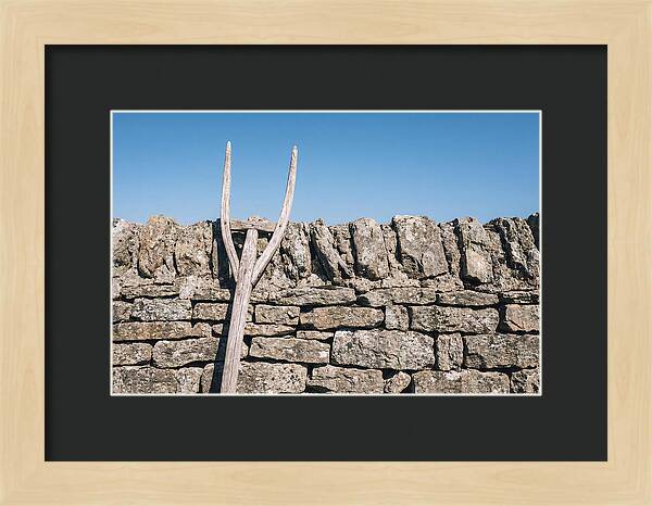 Old Wooden Hay Fork Against Stone Wall