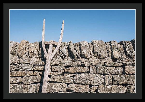 Old Wooden Hay Fork Against Stone Wall