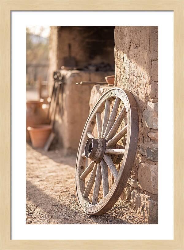 Old Wooden Wheel Against Wall