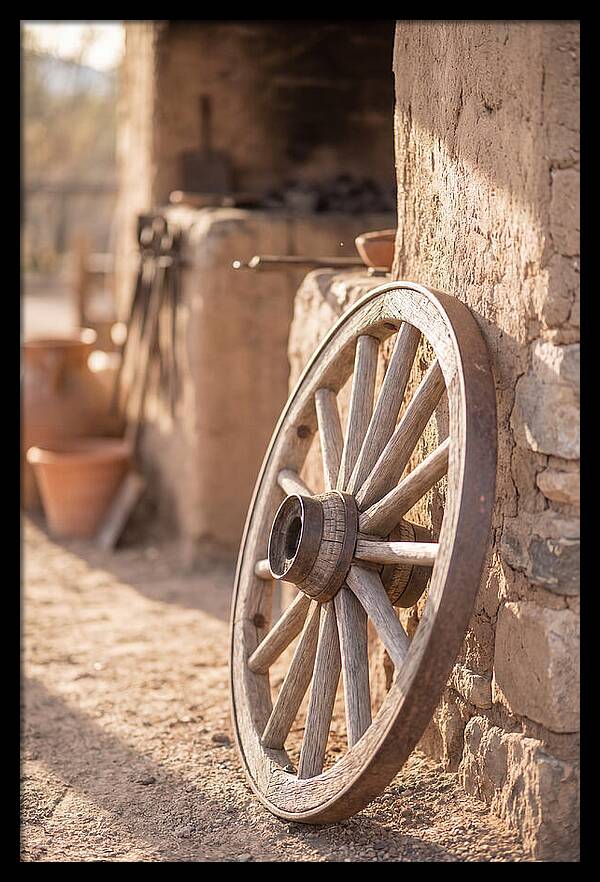 Old Wooden Wheel Against Wall