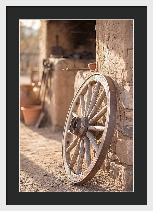 Old Wooden Wheel Against Wall