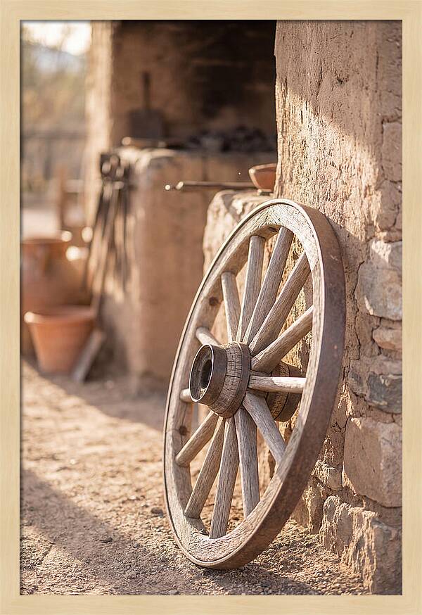 Old Wooden Wheel Against Wall