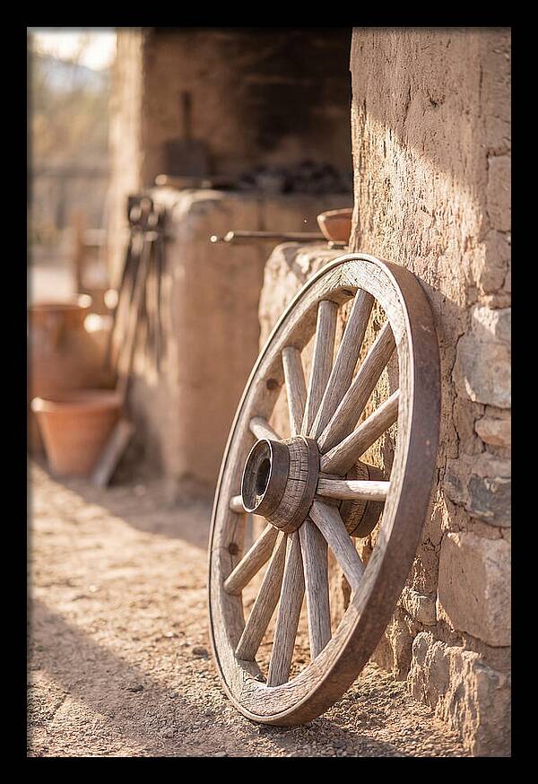 Old Wooden Wheel Against Wall