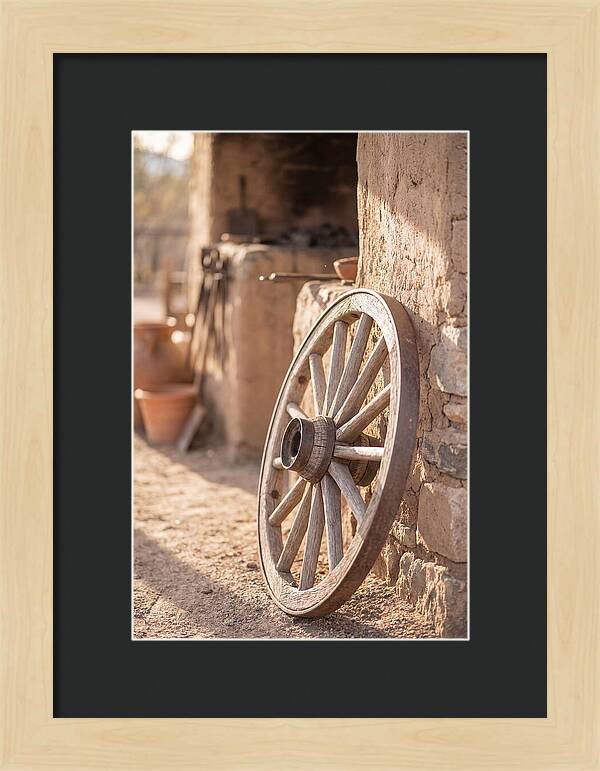 Old Wooden Wheel Against Wall