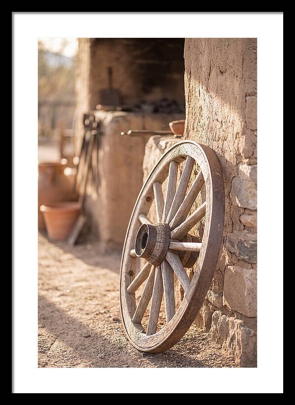 Old Wooden Wheel Against Wall
