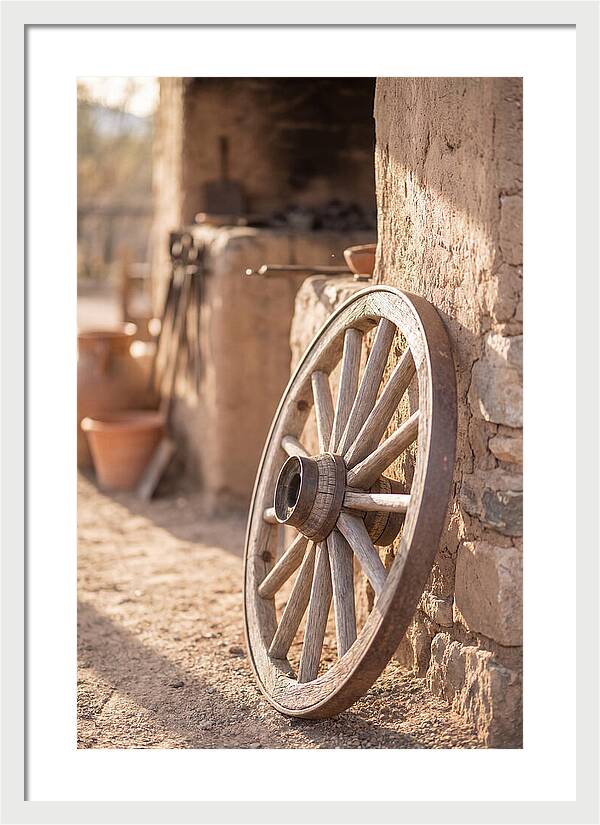 Old Wooden Wheel Against Wall
