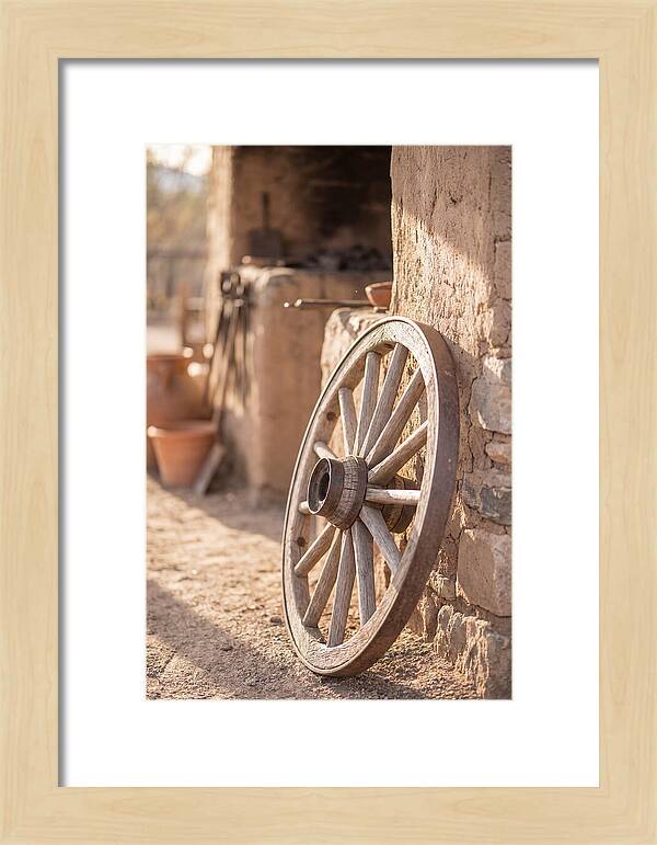 Old Wooden Wheel Against Wall