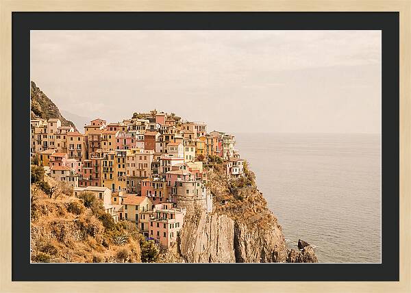 Pastel Village On Dramatic Cliffs