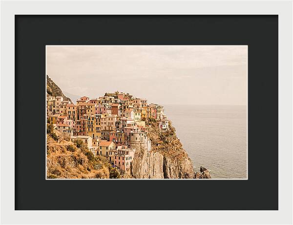 Pastel Village On Dramatic Cliffs
