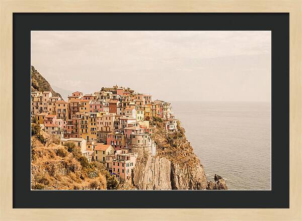 Pastel Village On Dramatic Cliffs