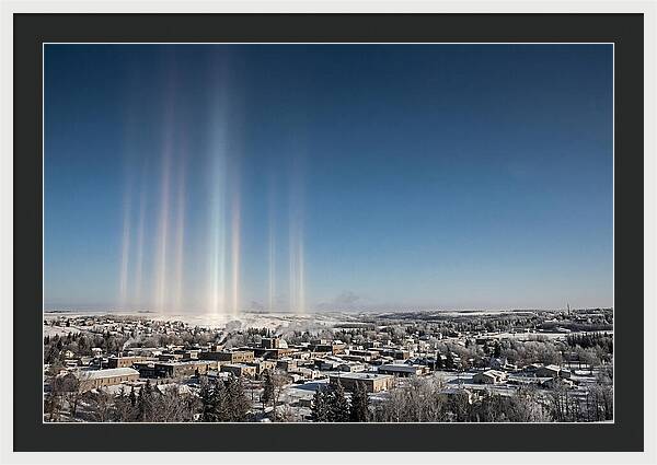 Pillars Of Light Over A Winter Town