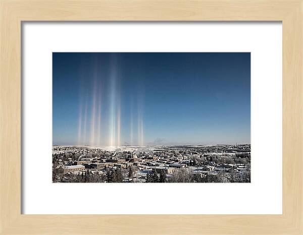 Pillars Of Light Over A Winter Town