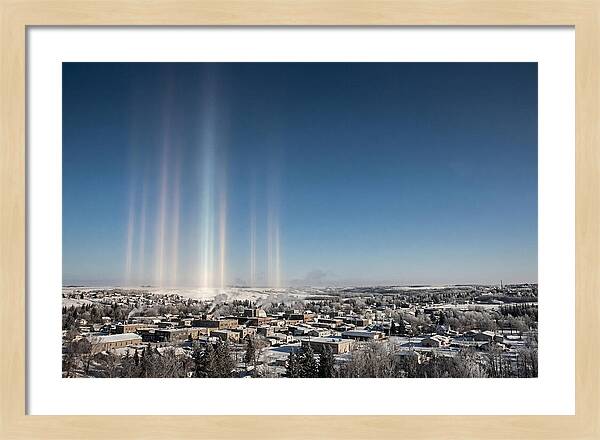 Pillars Of Light Over A Winter Town