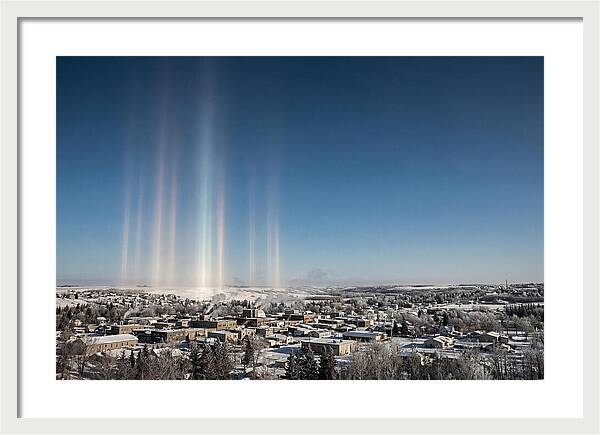 Pillars Of Light Over A Winter Town