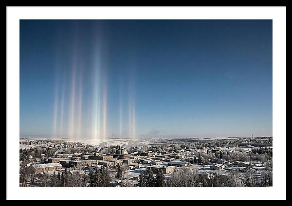 Pillars Of Light Over A Winter Town