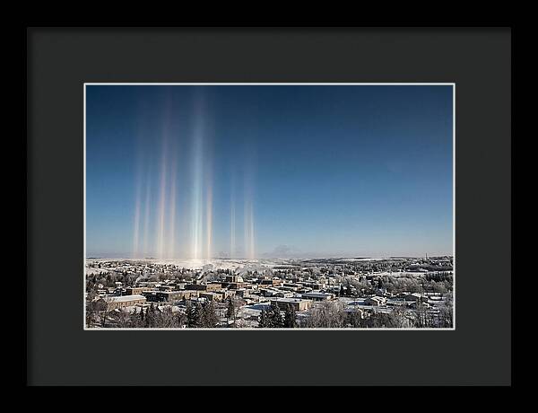 Pillars Of Light Over A Winter Town