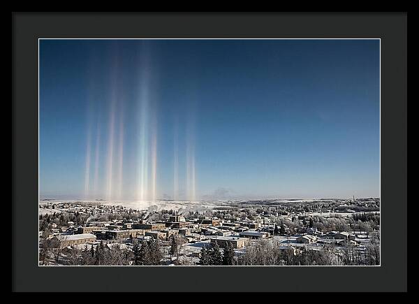 Pillars Of Light Over A Winter Town