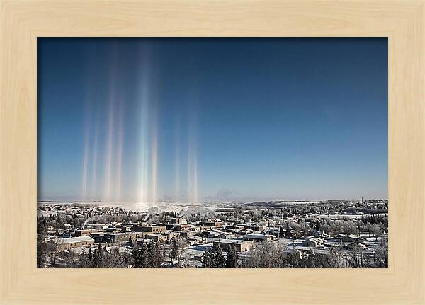 Pillars Of Light Over A Winter Town