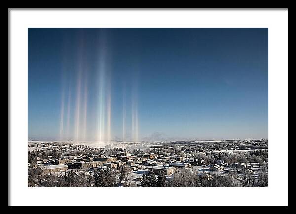 Pillars Of Light Over A Winter Town