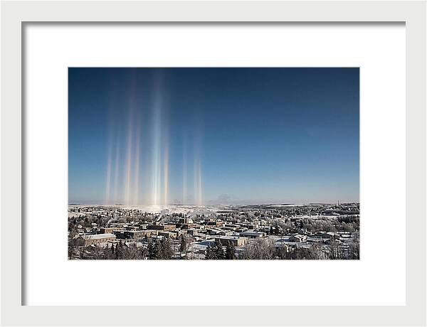 Pillars Of Light Over A Winter Town