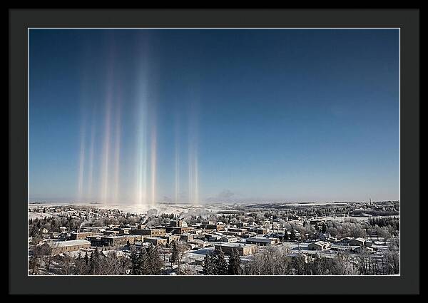 Pillars Of Light Over A Winter Town