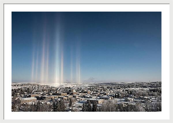 Pillars Of Light Over A Winter Town
