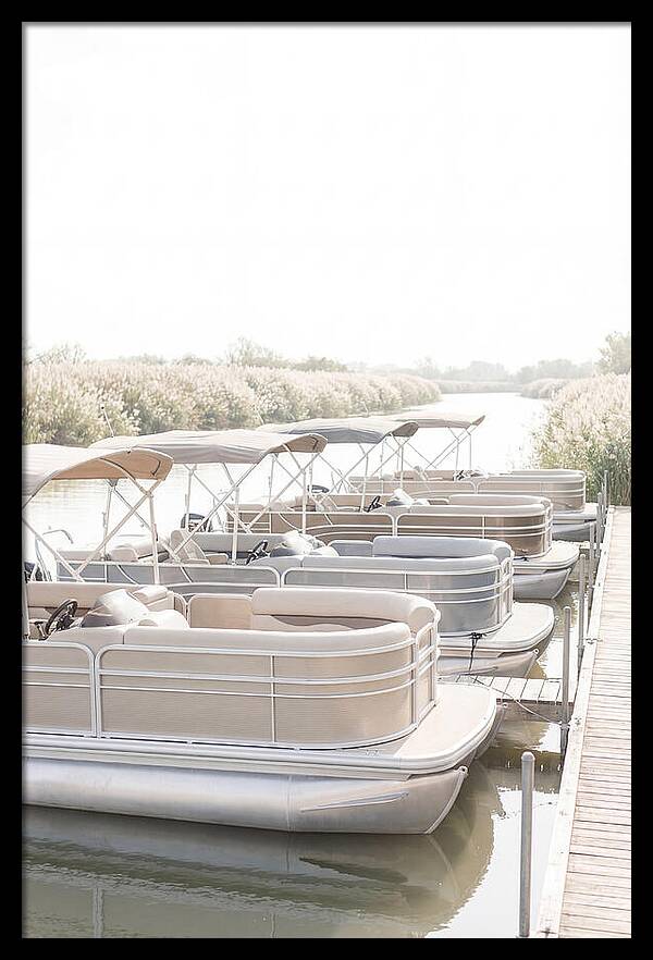 Pontoon Boats Along Reed Lined River