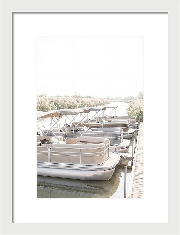 Pontoon Boats Along Reed Lined River